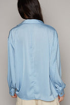 Light blue ribbed satin shirt back view.