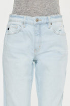 A pair of light blue jeans with a white logo on the back.