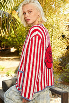 Red and white striped cardigan with rose.