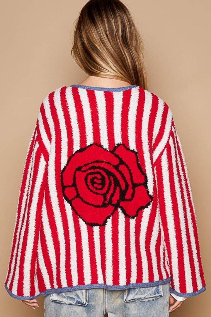 Red and white striped sweater with rose.