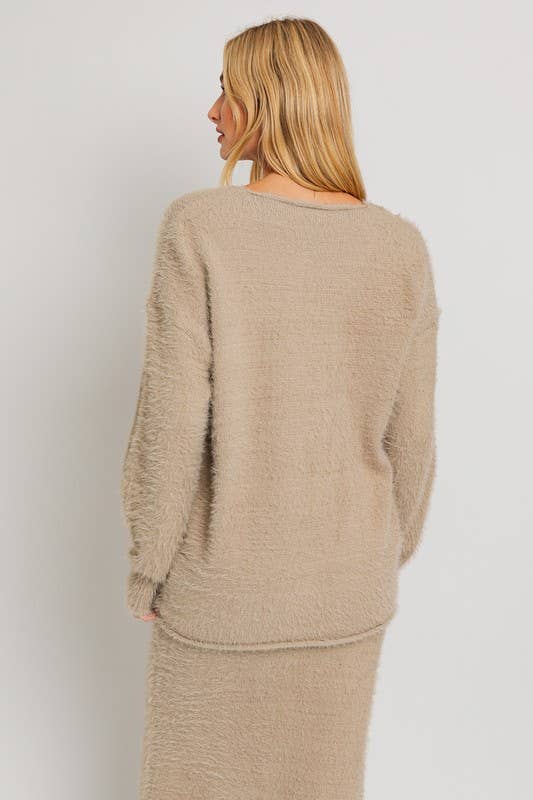 Beige fuzzy sweater and skirt set.