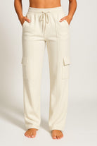 Grateful Threads Boutique cream cargo sweatpants with high waist and drawstring. Casual wide-leg pants.