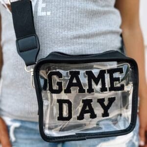 A person wearing a game day bag