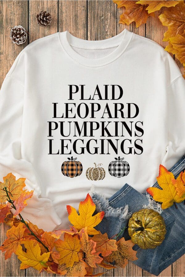 A white sweatshirt with plaid leopard pumpkins leggings.