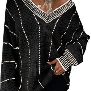 A woman wearing a black and white sweater.