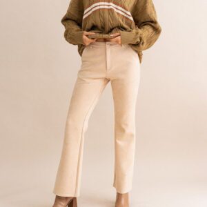 Beige suede pants and brown sweater.