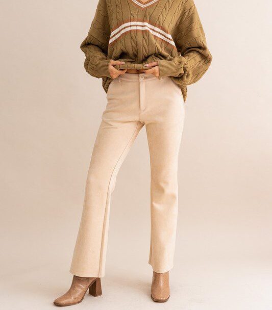 Beige suede pants and brown sweater.