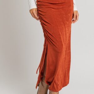 Rust side-tie maxi skirt with boots.