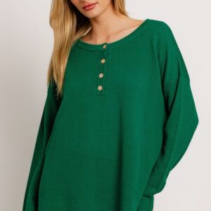 Green henley knit sweater and pants set.