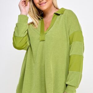 Here's an alt tag for the image: Green collared knit top with elbow patches.