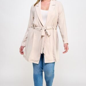 Beige belted jacket, plus size model.