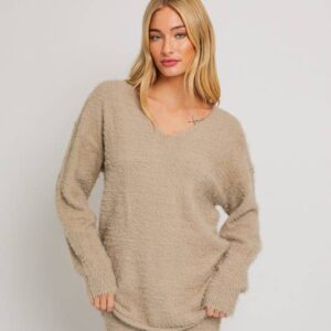 Woman in a beige fuzzy sweater.