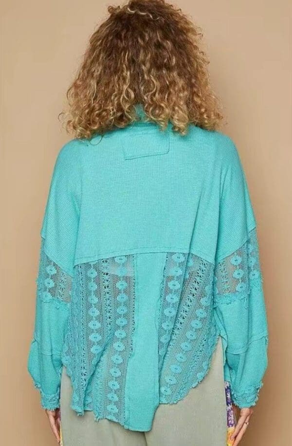 Teal lace-back sweater, rear view.