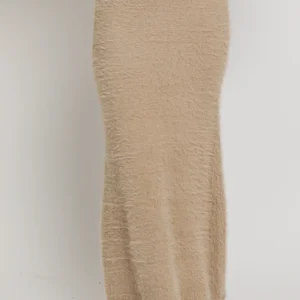 Beige fuzzy maxi skirt and shoes.