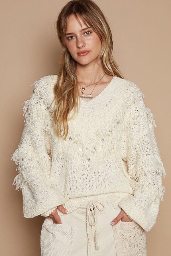 Cream embellished fringe sweater.